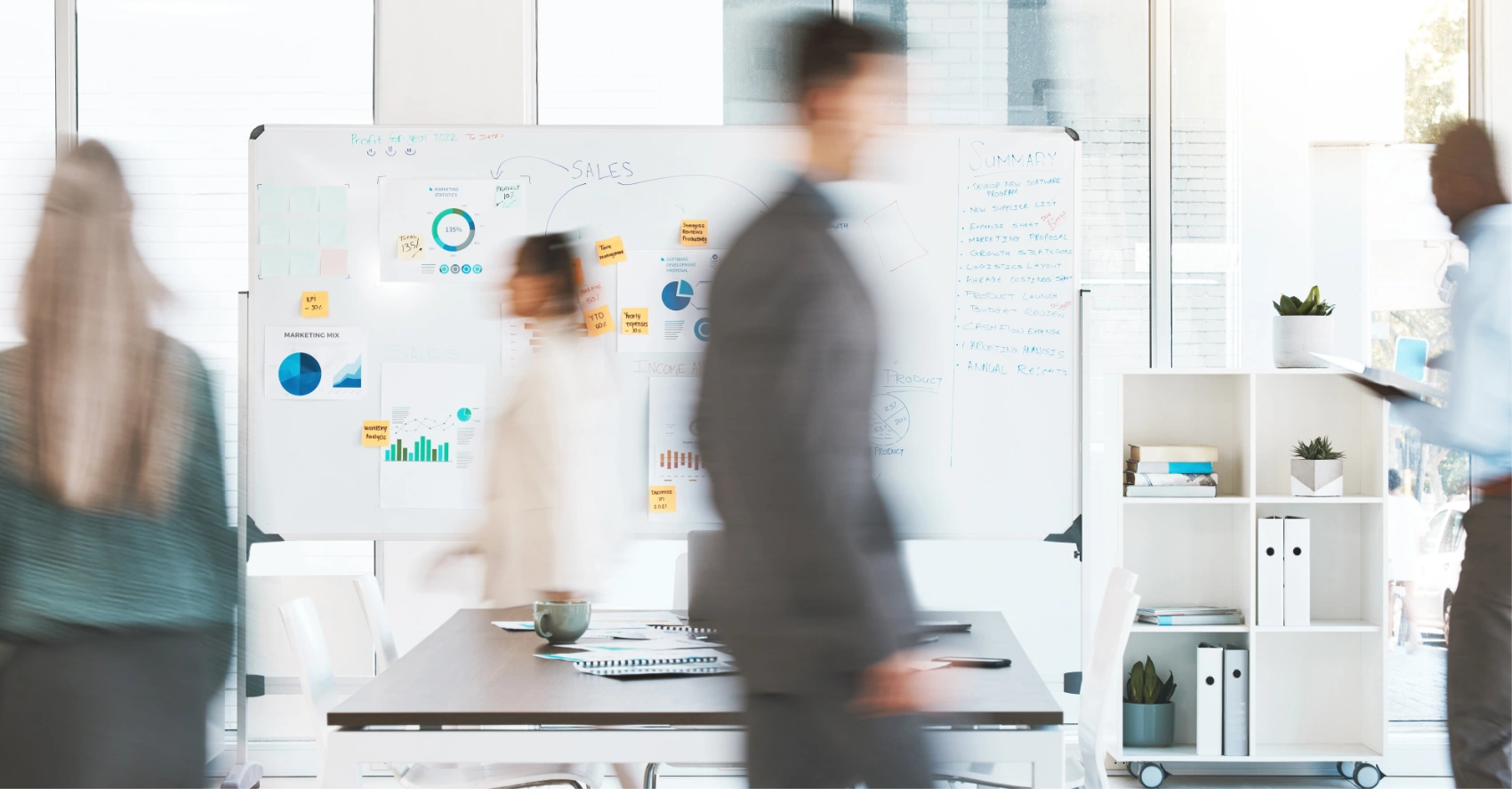 blurred people walking through office