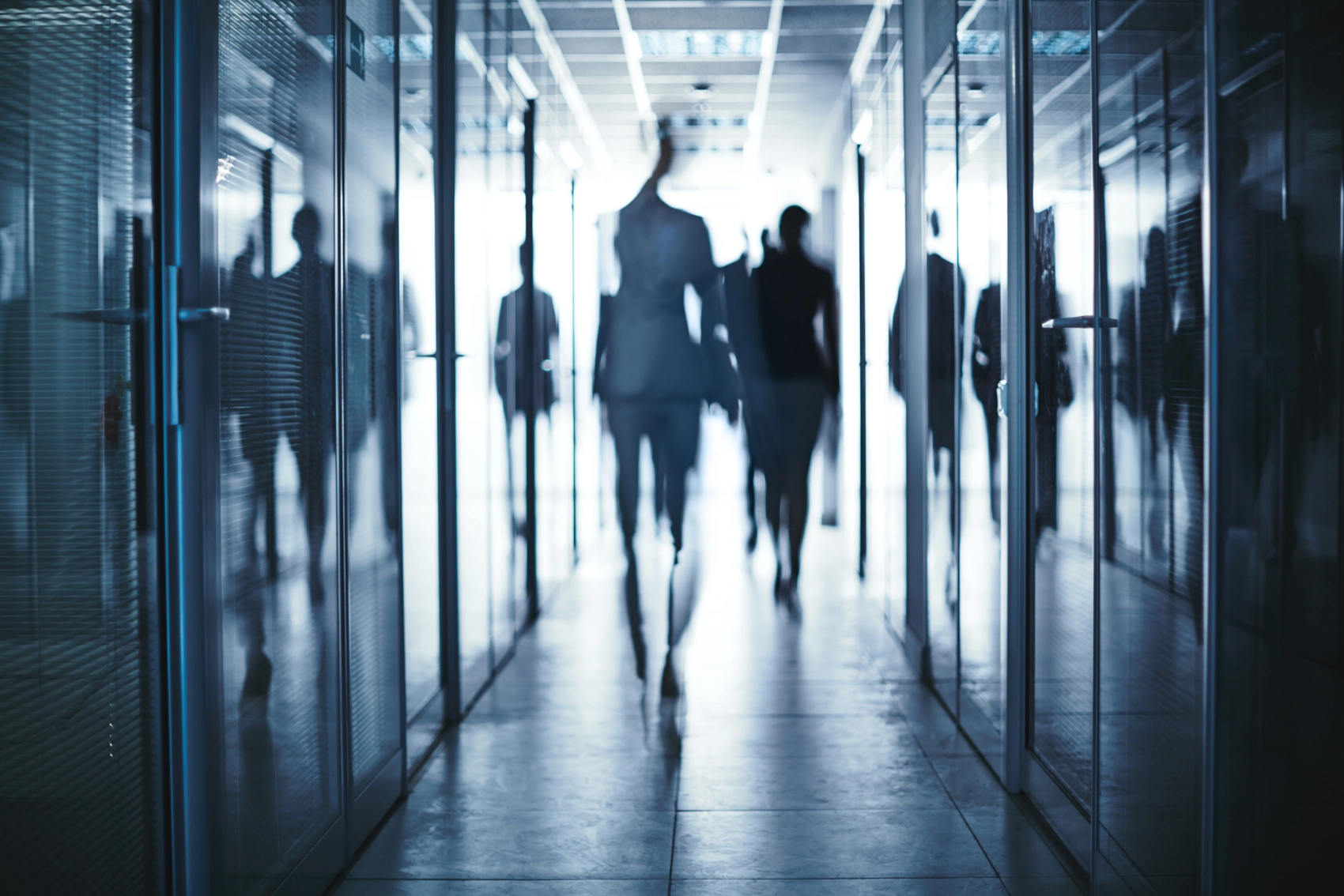 business people walking through office